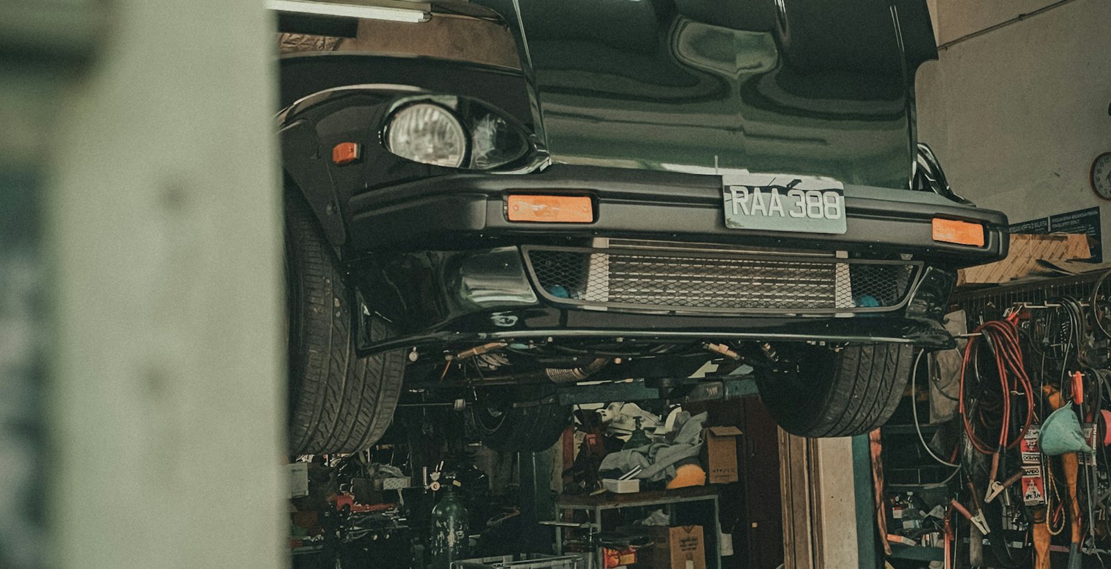 A car raised on the ramp for inspection
