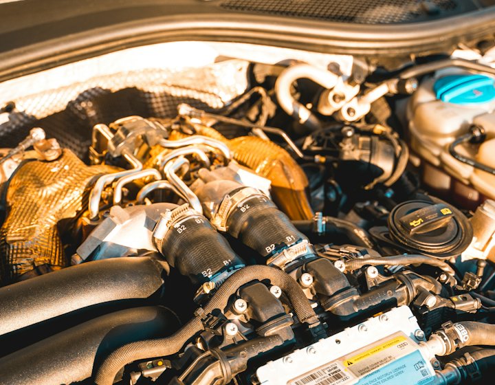 A diagnostic reader connected to a car engine