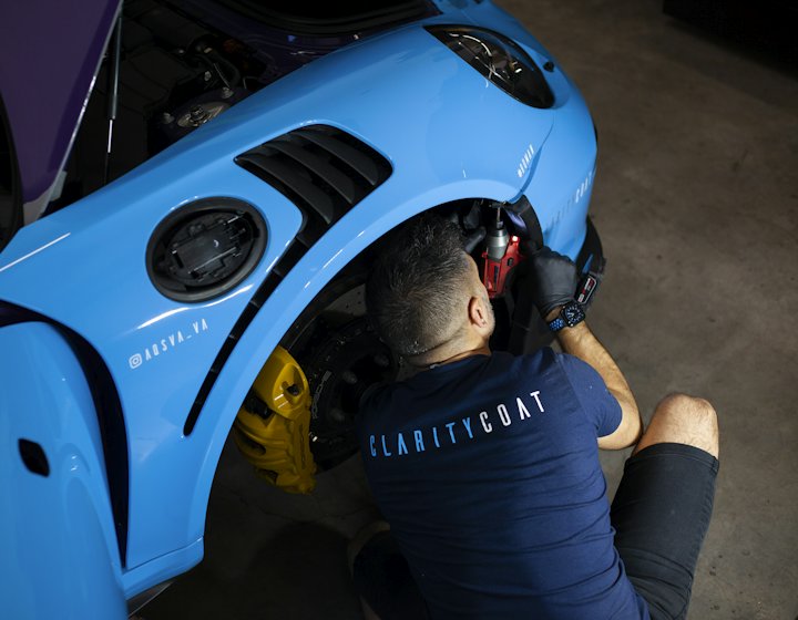 A car being serviced on the workshop floor